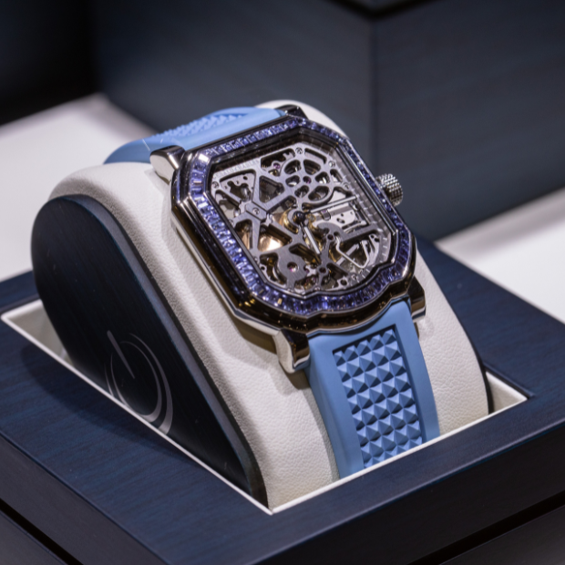 Two elegant watches featuring Roman numerals on their dials, showcasing classic design and timeless style.